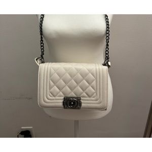 Cream vanilla over the shoulder purse.